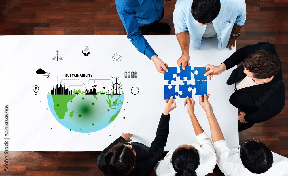Fototapeta premium A diverse group of professionals collaborates on sustainability initiatives, piecing together solutions illustrated with environmental graphics representing a collective global responsibility. Trope