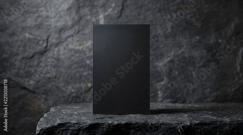Blank black rectangular product mockup on a dark textured stone