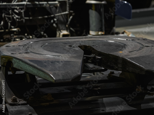 Detail of the fifth wheel coupling ramp on a semi-truck tractor.