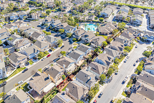 Carson, California, CA January 14, 2025: High Aerial Drone Photo View toward Hometown, Community, Streets, Homes, Houses, Sunny Day
