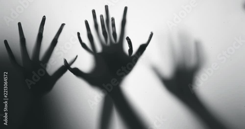 Shadow of a zombie hand on white background
