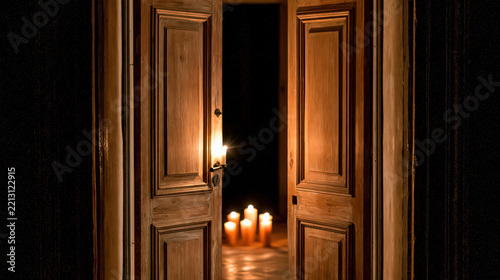 Wooden door open doorway candlelight medieval interior