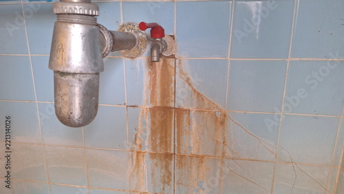 Rusty Faucet Pipe Stains Blue Bathroom Tile