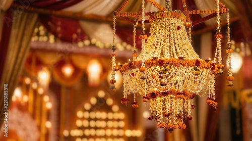 Diwali floral chandelier decoration hanging in a festive wedding venue