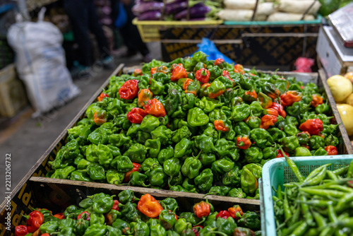 Colorful Maldivian Scotch Bonnet chili peppers in boxes at local farmers' market in Malé. In Maldives they are known as *Githeyo mirus*. Fresh tropical peppers used in traditional Maldivian cuisine