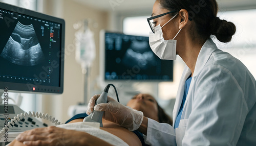 Medical Professional Performing an Ultrasound Examination Using Diagnostic Imaging Equipment
