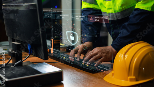 Fotografie Industrial worker analyzes network risk and unusual activity on a cybersecurity dashboard