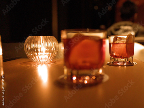Cocktail Drinks and Candle on Table in Dimly Lit Bar
