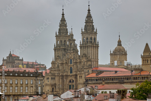 Cathedral of Santiago de Compostela under dramatic cloudy sky in Galicia.