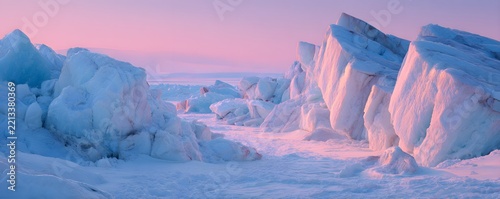 Glacial ice formations lit by pastel pink light, panoramic