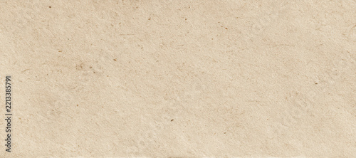 Beige recycled paper texture with visible fibers and speckles