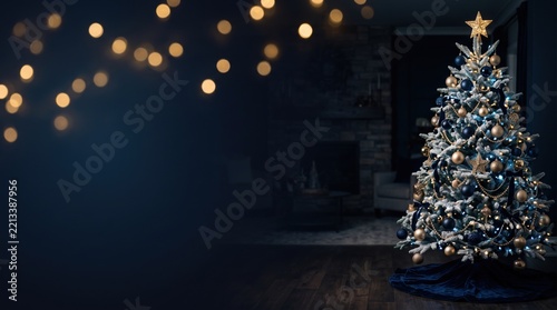 Festive Christmas Tree and Bokeh Lights in Dark Cozy Living Room.