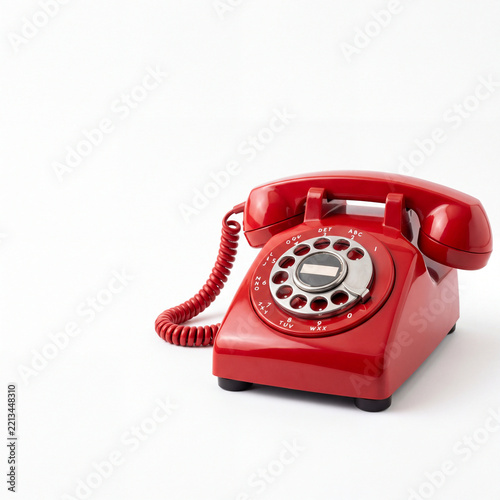 Vintage Red Rotary Phone on White Background with Copy Space