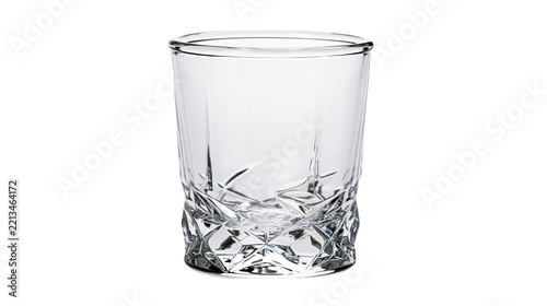 Isolated empty clear crystal faceted whiskey glass tumbler for cocktails and spirits
