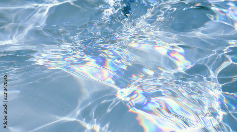 Fototapeta premium Water ripple reflection light abstract blue texture surface wave pattern Calm water ripple reflection with soft abstract blue texture surface wave pattern and subtle rainbow light refraction