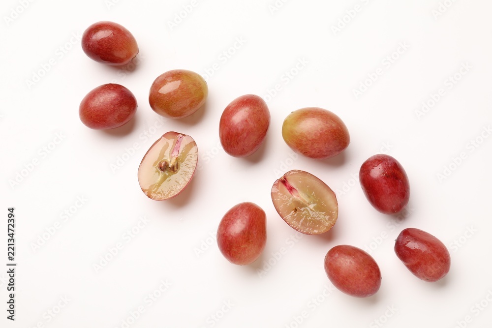 Fototapeta premium Fresh ripe grapes on white background, flat lay
