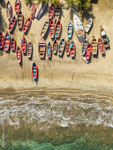 Aerial top down view of wooden fishing boats lined up, Tarrafal beach Cape Verde