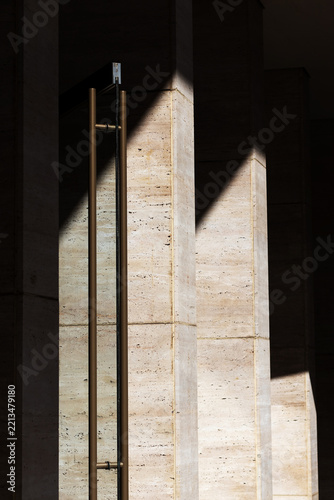 Minimalist Architectural Details of Rough Stone Walls. Texture with Deep Shadows. Close-up.
