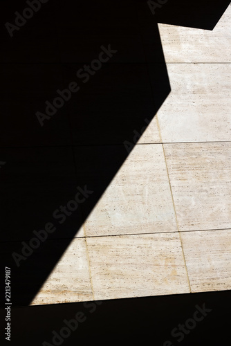 Minimalist Geometric Architectural Details of Rough Stone Walls with Deep Shadows. Close-up