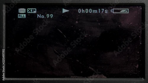 Light sweeping over dusty, smudged MiniDV camera display overlay, perfect video overlay via blend mode.