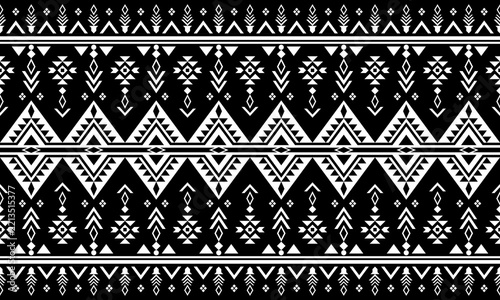 Black and white geometric tribal pattern with traditional ethnic motifs.