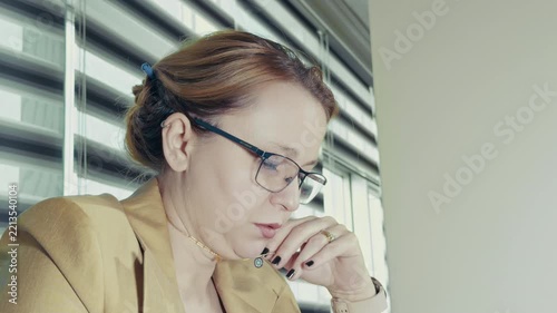 Detail Shot of Female Office Worker using Laptop at Desk
