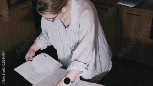 Female Employee Organizing Paperwork in Corporate Archive