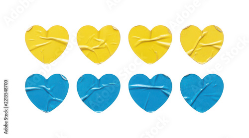 Eight wrinkled heartshaped stickers in yellow and blue colors isolated on transparent background