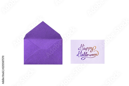 Overhead view of a purple glitter envelope and a handwritten 