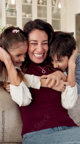 Happy, mother and hug in home with children, connection and family love bonding together on weekend. Woman, kids and embrace in living room with security, affection and quality time for wellness.