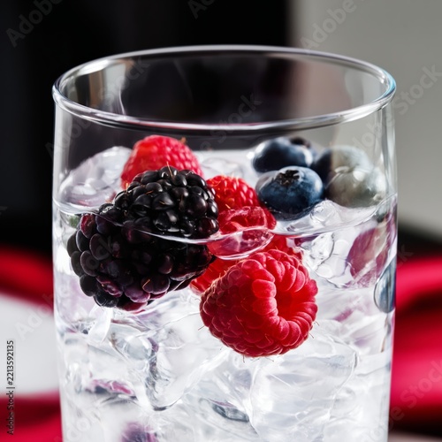 Cold Drink With Ice and Berries in a Glass
