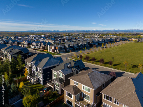 Suburban homes in Calgary looking out to the Rocky Mountains in the distance.