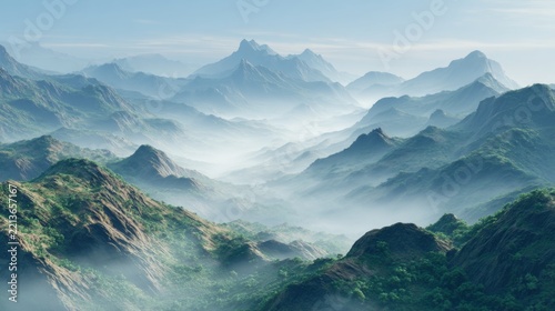 Majestic green mountain ranges covered in soft morning mist under daylight
