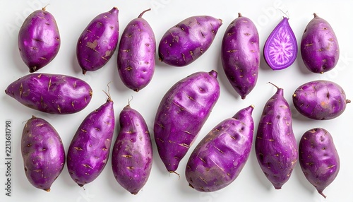 Purple sweet potatoes arranged naturally on clean white