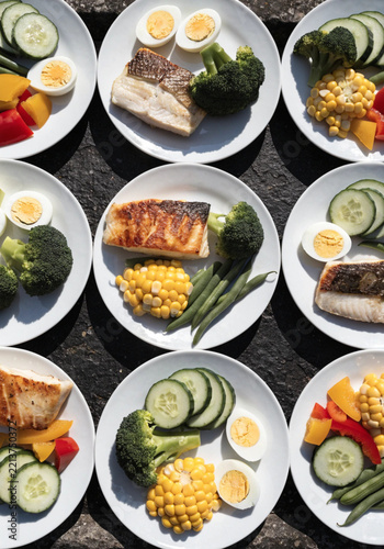 Plates of Healthy Meals with Fish and Vegetables