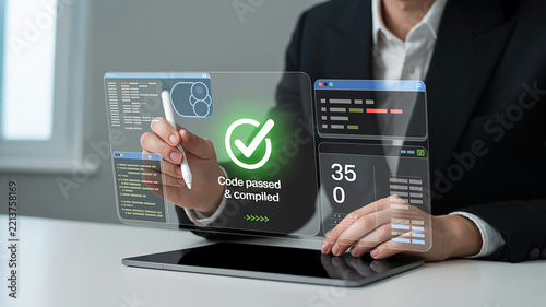 Obraz na płótnie Software developer using a digital tablet to verify code on a