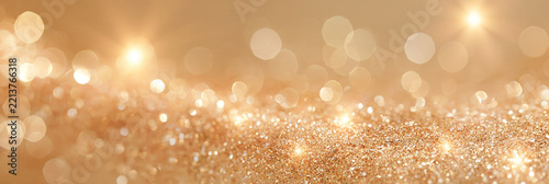 Abstrakter goldener Bokeh-Hintergrund mit funkelnden Lichtpunkten in Beige