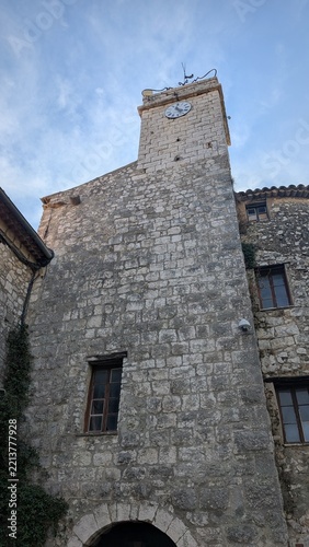 Historic stone clock tower in Tourrettes-sur-Loup, France. 