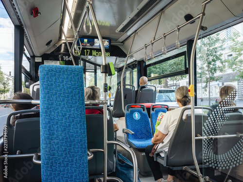 City passenger in the bus. Public transport interiors