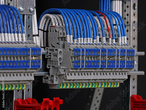 Electrical screw terminals for connecting copper electrical wires with metal lugs in electrical switchboard. 