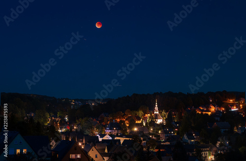 Lunar Eclipse Over Seiffen Village in Saxony, Germany