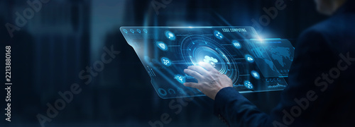 Businessman analyzing Edge Computing and distributed network processing data on digital screen. Low latency architecture, IoT local gateway, real-time data handling, cloud technology.