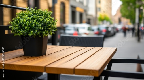 Picturesque Sidewalk Cafe Setting Showing Outdoor cafe terrace overlooking busy city street no logos st