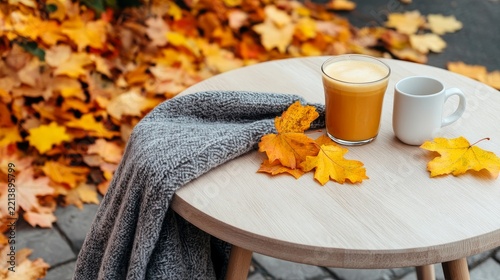 Relaxed Urban Dining Atmosphere with Street cafe outdoor under autumn leaves warm drinks blankets