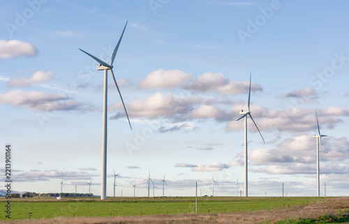Obraz na plátně Wind turbines generating clean energy in a rural landscape
