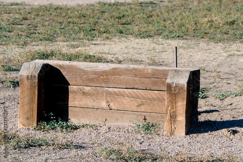 Wooden obstacles on a dry park field