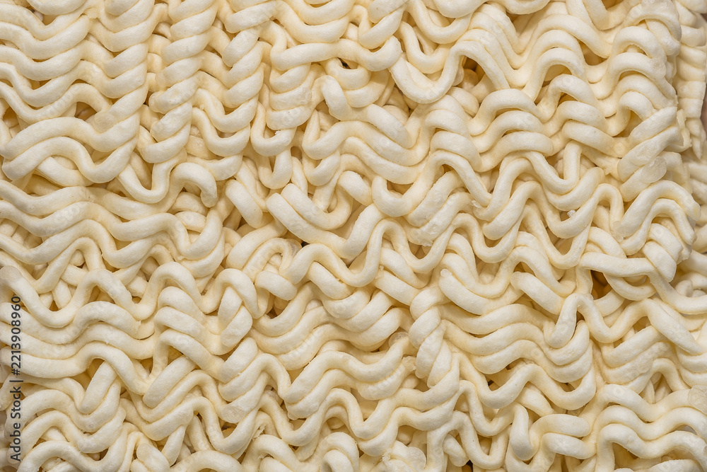 Obraz premium Instant Ramen Noodles Close-Up Dried Food Texture Background