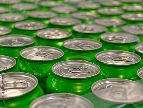 Obraz na plátně Green aluminum beverage cans grouped in packages at a warehouse show a clear sup