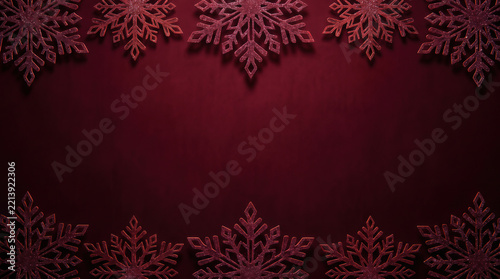 Red Christmas background with glitter snowflakes border frame flat lay