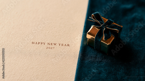 A single elegant gold gift box with a velvet ribbon on a deep blue velvet surface